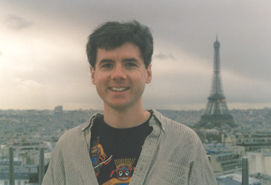 Photo of John atop the Arc de Triomphe, Paris, France, 1998.
