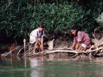 photo of girls on river bank