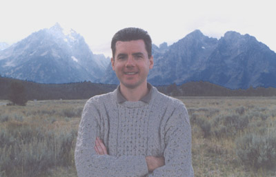 Photo of John in front of Teton peaks